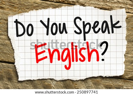 Note with do you speak english? on the wooden background
