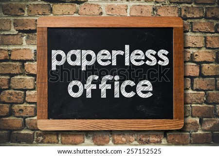 Paperless office on Blackboard. Paperless office on Blackboard on bricks wall