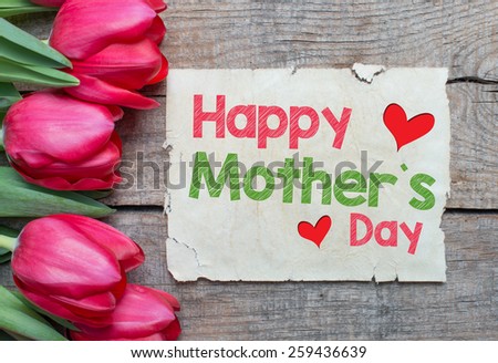Happy Mother\'s day with Tulips. Tulips and paper with text Happy Mother\'s day