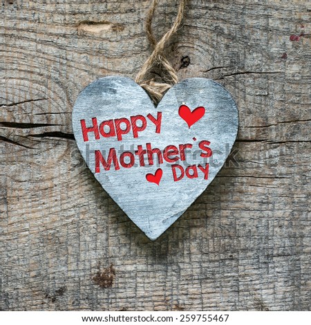 Happy Mother's day on heart. Happy Mother's day on wooden heart.