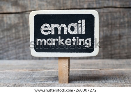 Email marketing on blackboard. Email marketing handwritten on framed blackboard