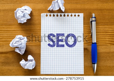 Blank note paper with seo. Blank note paper with seo and pen on wood background