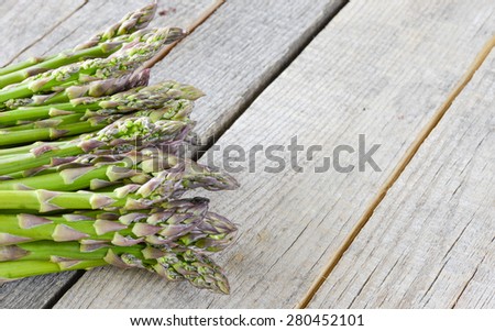 Fresh green asparagus. Fresh green asparagus on wooden background