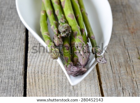 Fresh green asparagus. Fresh green asparagus on wooden background
