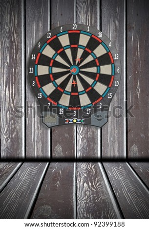 Dart Board, wood paneling in the background