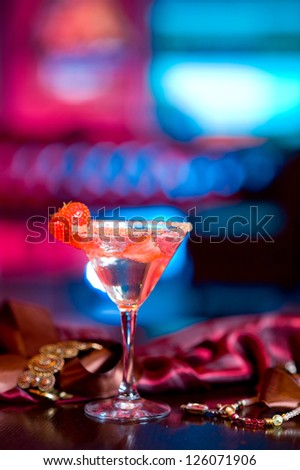 a cup of martini with strawberry