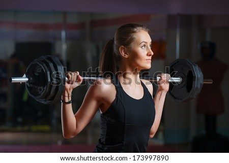 Young woman weight training