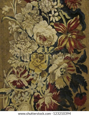 Closeup of retro tapestry fabric pattern with classical image of the colorful floral ornament Closeup of retro tapestry fabric pattern with classical image of the colorful floral ornament