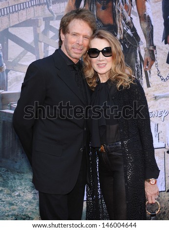 LOS ANGELES - JUN 22:  Jerry Bruckheimer & wife Linda arrives to the 'The Lone Ranger' Hollywood Premiere  on June 22, 2013 in Hollywood, CA