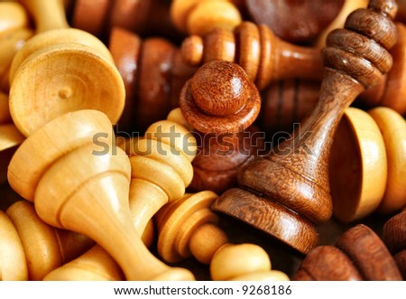 Chess pieces piled up in a box