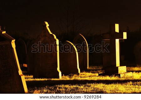 spooky graveyard at night
