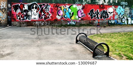 graffiti wall with bike rack at park