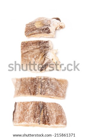 Dried salt cod fish isolated on a white studio background.