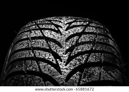 stock photo car tire on black background