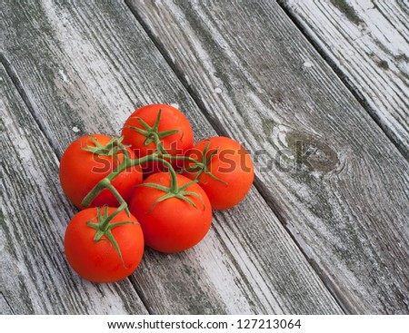 Vine tomatoes on reclaimed wood background