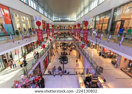 DUBAI, UAE - October 07, 2014: Shoppers at Dubai Mall in Dubai, United Arab Emirates. Dubai Mall is one of the largest mall in the world.