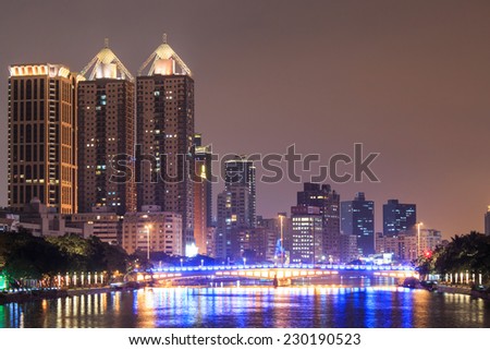 Kaohsiung, Taiwan - November 10, 2014:  Love River at night and  Kahosiung city skyline - Taiwan