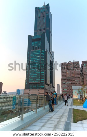Kaohsiung, Taiwan - February 26,2015: People next to the Tuntex Sky Tower watching the Sunset .