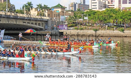 Kaohsiung, Taiwan, June 20, 2015: Boats racing in the Love River for the Dragon Boat Festival in Kaohsiung, Taiwan.