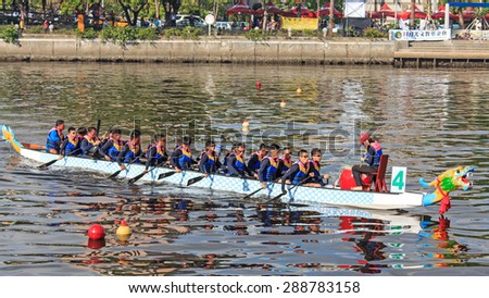 Kaohsiung, Taiwan, June 20, 2015: Boats racing in the Love River for the Dragon Boat Festival in Kaohsiung, Taiwan.