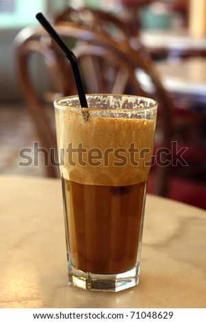 Greek coffee, cold Frappe drink on a marble table