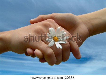 stock photo : Children holding hands, symbolizing friendship.