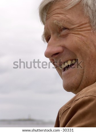 Portrait of old man laughing