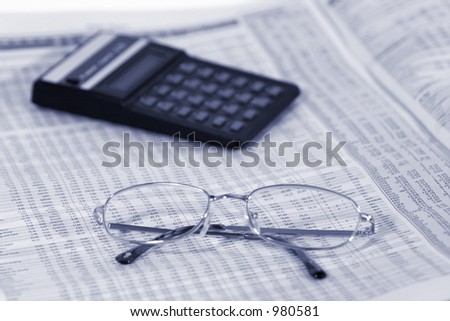 Glasses and calculator on financial statistics