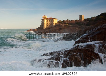 Boccale castle, famous landmark in Tuscany northern shore with sea sprays on the rocks