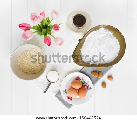 Ingredients for French macarons laid out. Ingredients include ground almonds (or almond flour), icing sugar (powdered or confectioners sugar), caster sugar and egg whites.