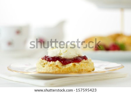 English Cream tea scene with scones, Cornish style. Part of a series showing the preparation of scones.