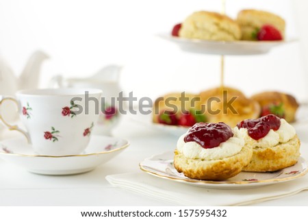 English Cream Tea Scene With Scones, Devonshire Style, On China Plate With Teacup And Saucer. Part Of A Series Showing The Preparation Of Scones.