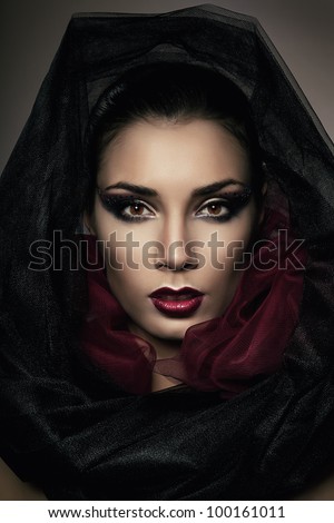close-up portrait of woman in black hood
