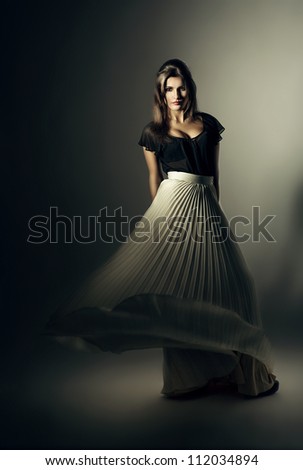 woman in white skirt on wind