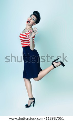 happy funny woman with open mouth on one leg