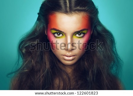 serious girl with eye shadows on face