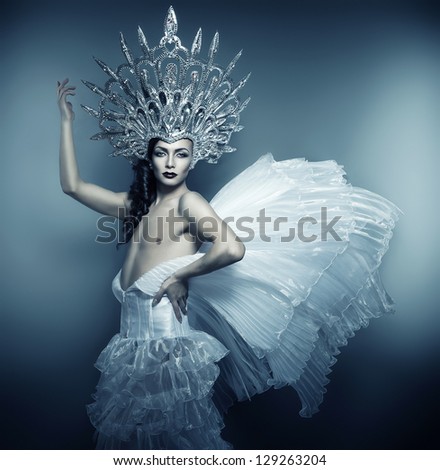 man in silver crown and white dress