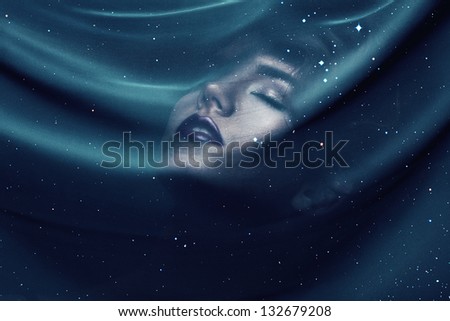 woman under transparent textile with stars