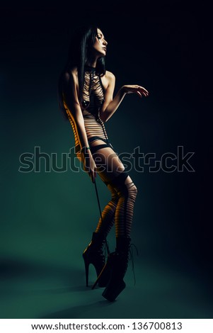 bizarre woman with whip
