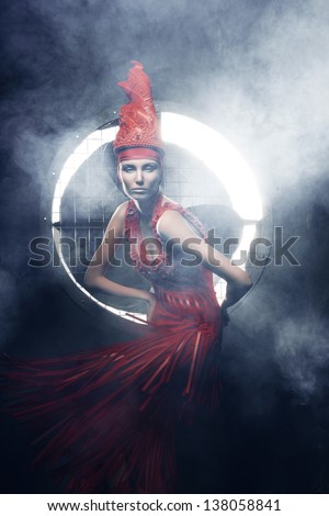 woman in red in circle of light