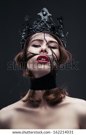 portrait of pretty woman in black crown