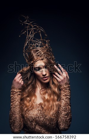 woman with gold accessory on head
