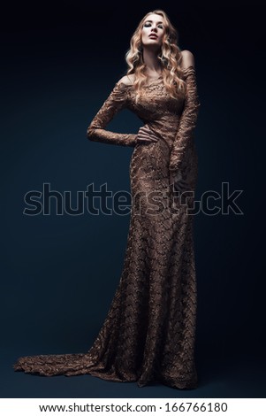 Blond Woman In Long Gold Dress