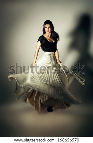 mystic woman with flying white skirt