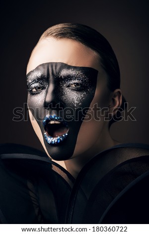 woman in black mask and opened mouth