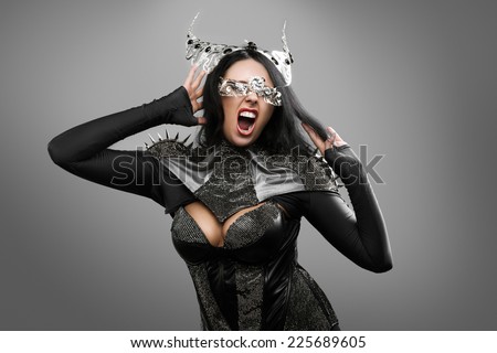 Screaming woman in a dark style on gray background