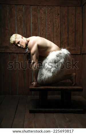 Strong man sit down in a room