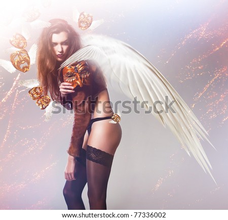beautiful sexy woman with wings and flying masks