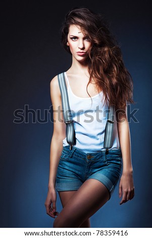 sexy attractive woman in shorts with suspenders
