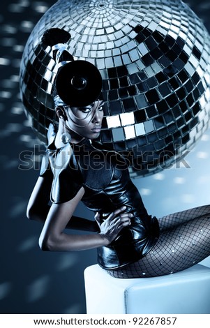 Attractive african woman with disco ball